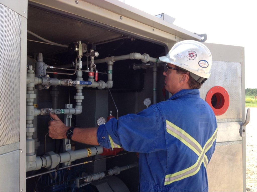 A professional inspecting all the parts demonstrates best practices for compressor longevity, from installation to maintenance.