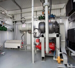 Industrial methane reduction system with advanced gas compression and emissions control equipment inside a natural gas processing facility designed to improve operational efficiency and reduce methane emissions.