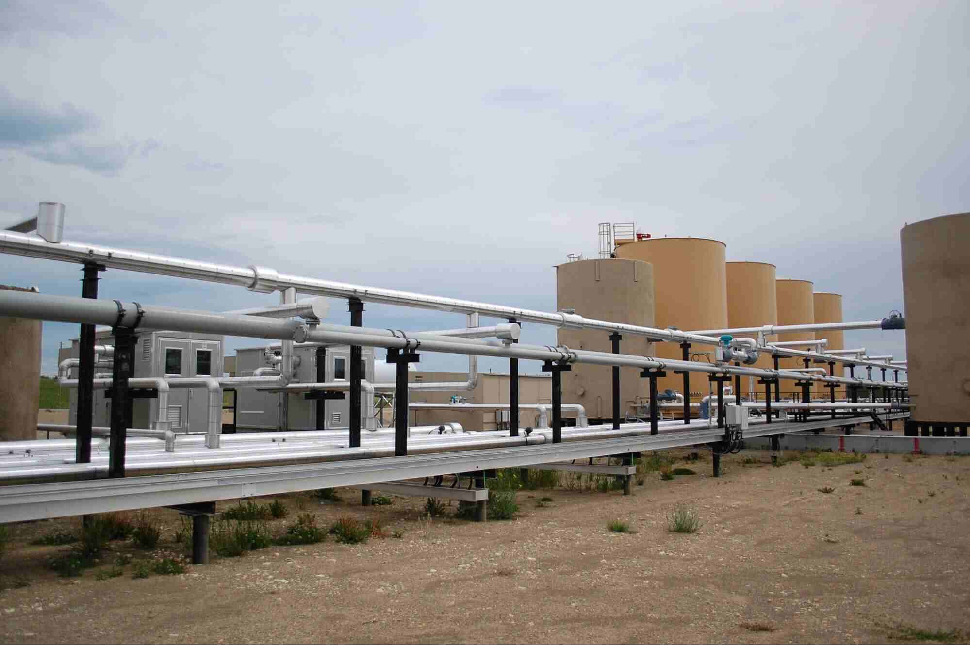 Natural gas compressor station with pipelines and processing equipment used to regulate and move natural gas.
